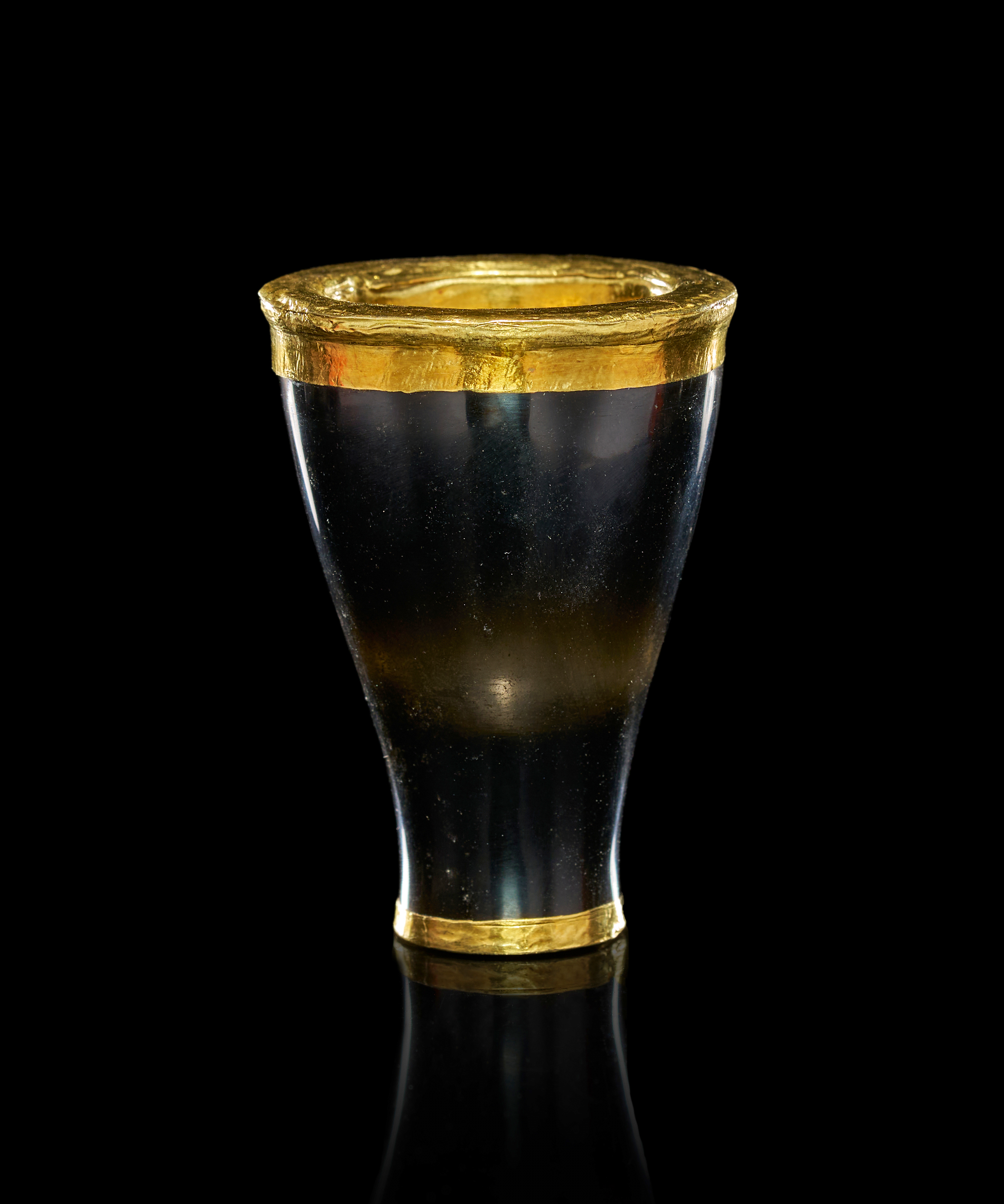 AN EGYPTIAN OBSIDIAN AND GOLD FOIL KOHL POT, MIDDLE KINGDOM, 12TH DYNASTY, CIRCA 1976-1794 B.C.