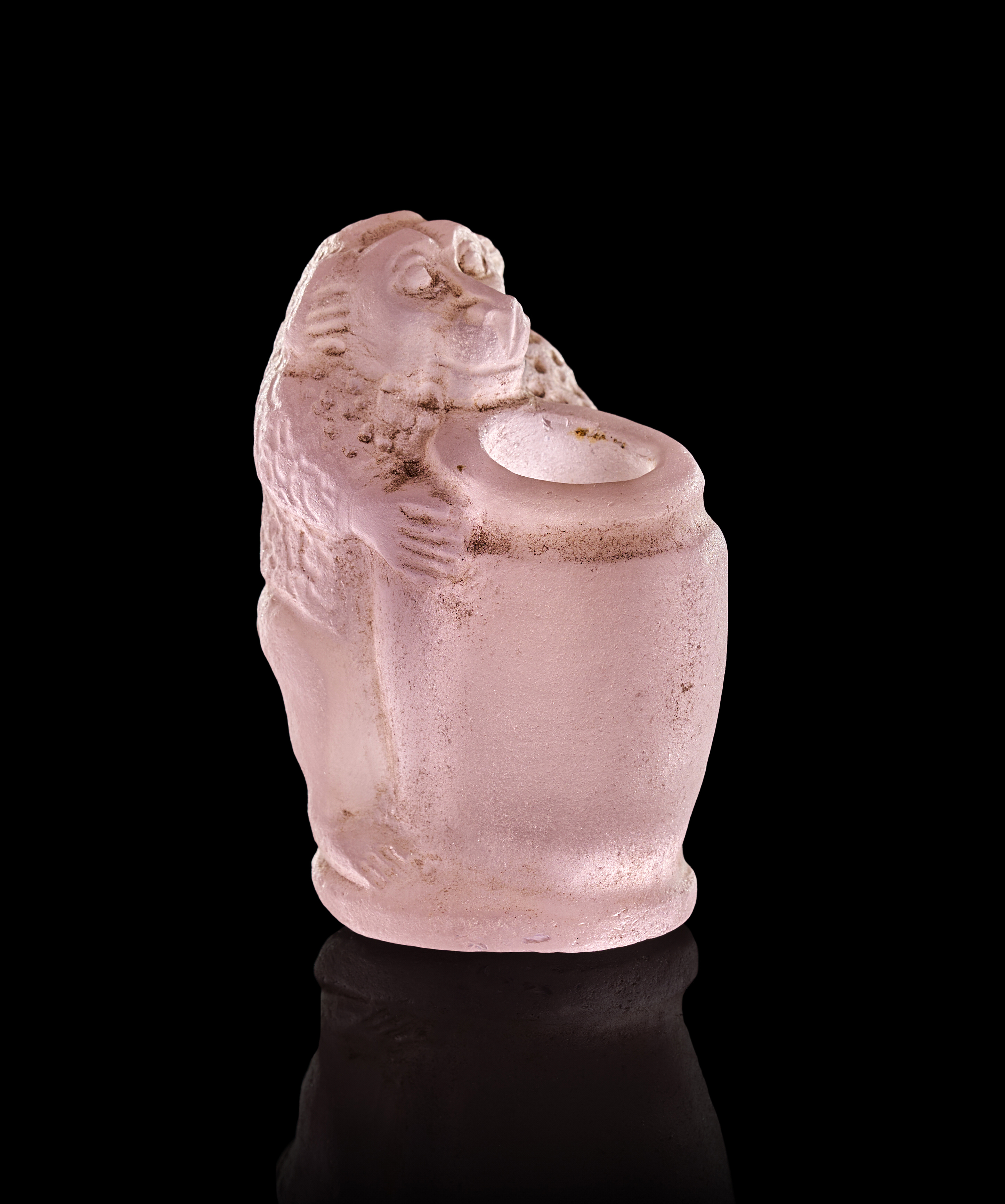 A RARE AMETHYST EGYPTIAN COSMETIC OR OINTMENT JAR WITH A BABOON, PTOLEMAIC PERIOD, 300–200 B.C.