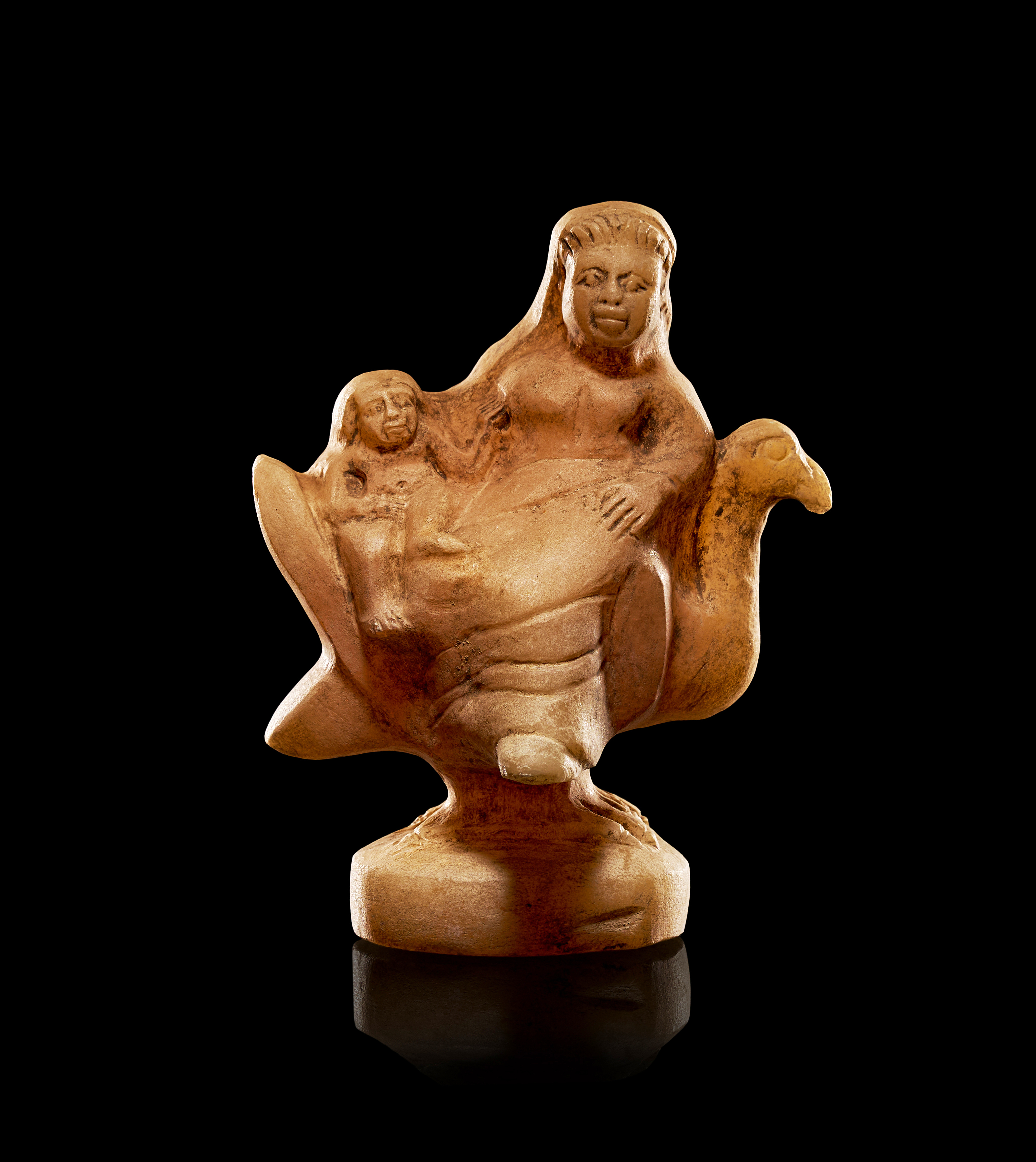 ALABASTER FEMALE FIGURE SEATED ON A DOVE, EASTERN GREEK PERIOD OF 300- 200 B.C.