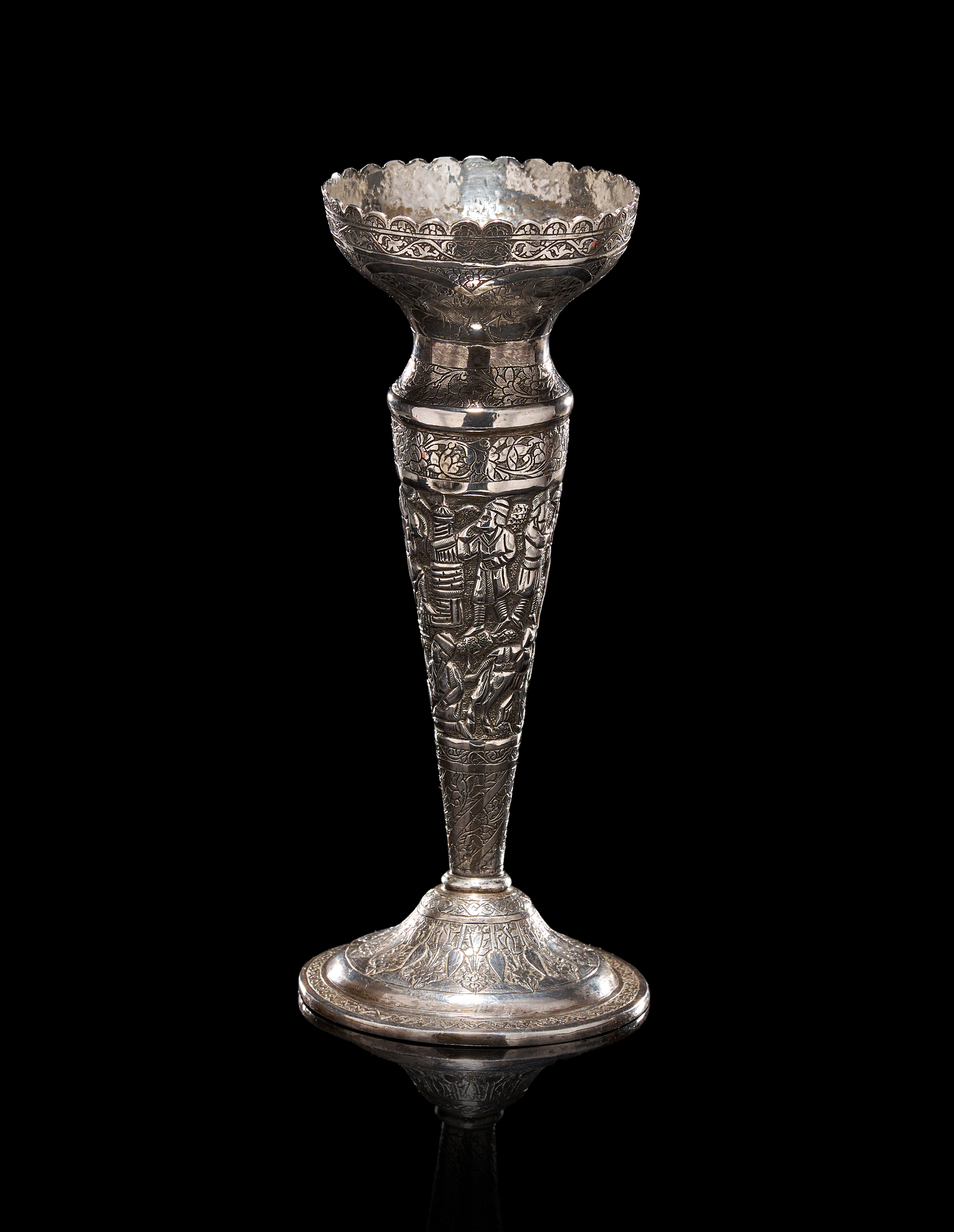 A PERSIAN SILVER REPOUSSE BUD VASE