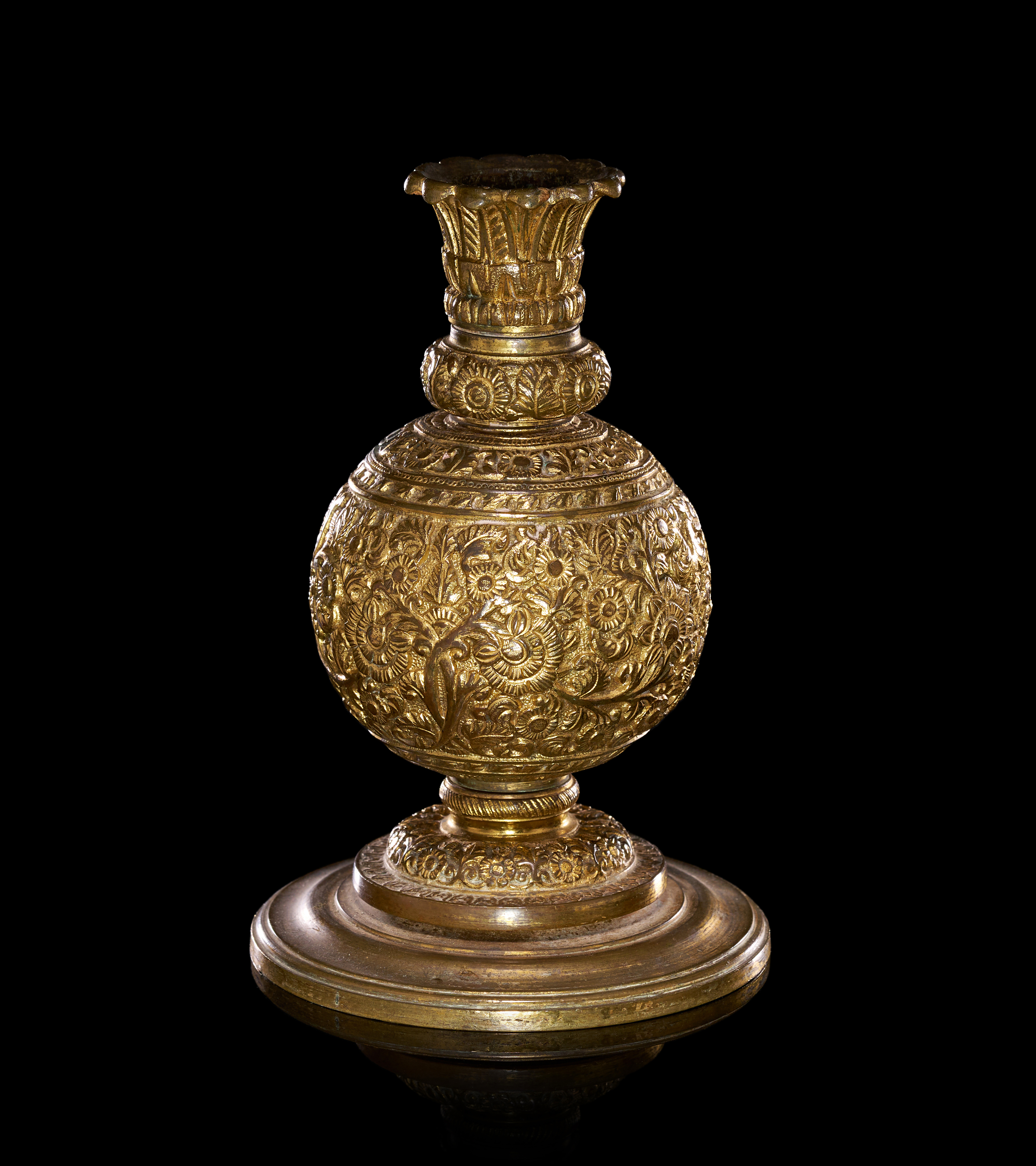 A REPOUSSE GILT METAL ANGLO INDIAN CANDLESTICK, 19TH CENTURY