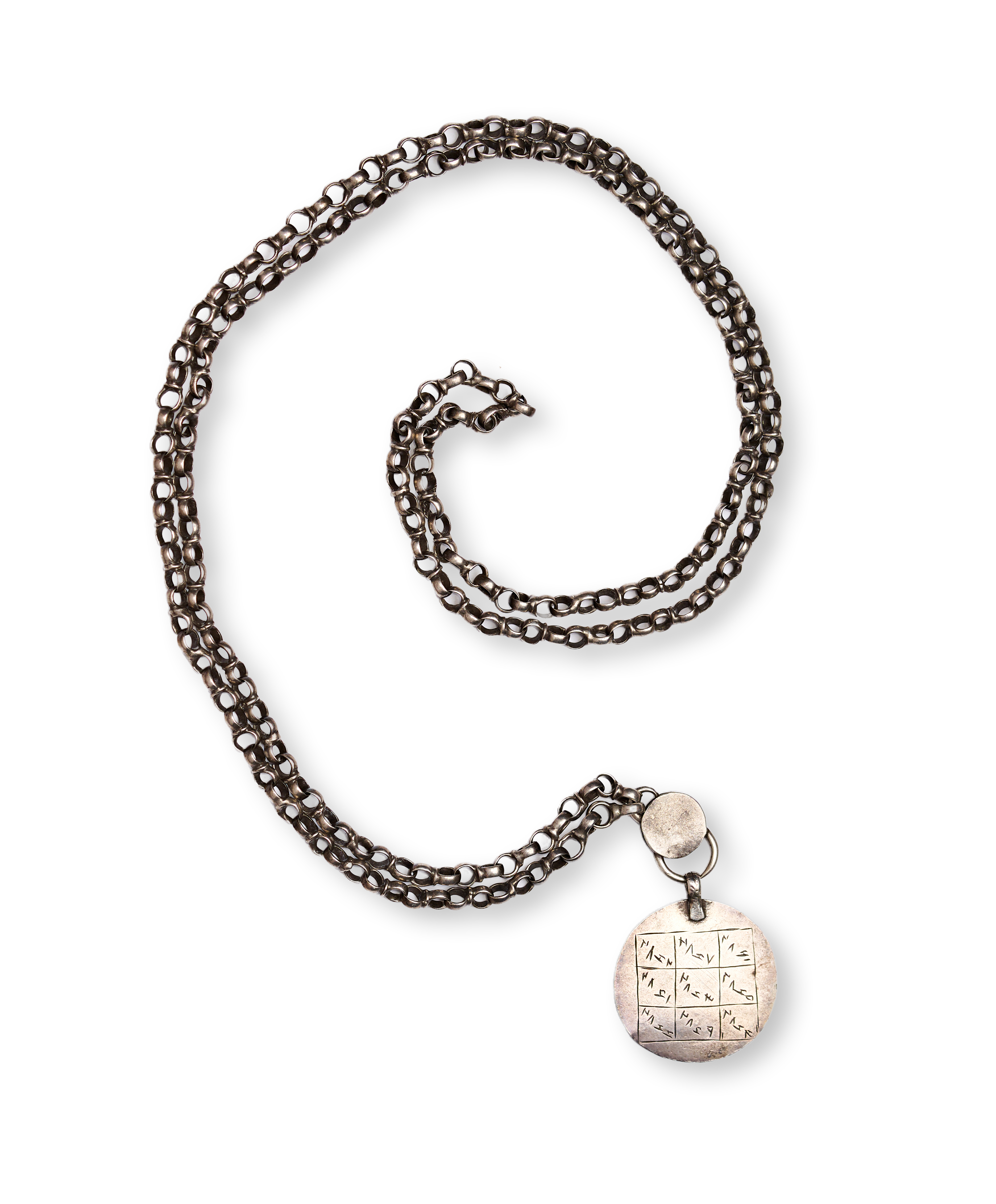 AN ENGRAVED SILVER TALISMANIC AMULET/PENDANT NECKLACE WITH HAND-INCISED INSCRIPTIONS, QAJAR PERSIA, 19TH CENTURY