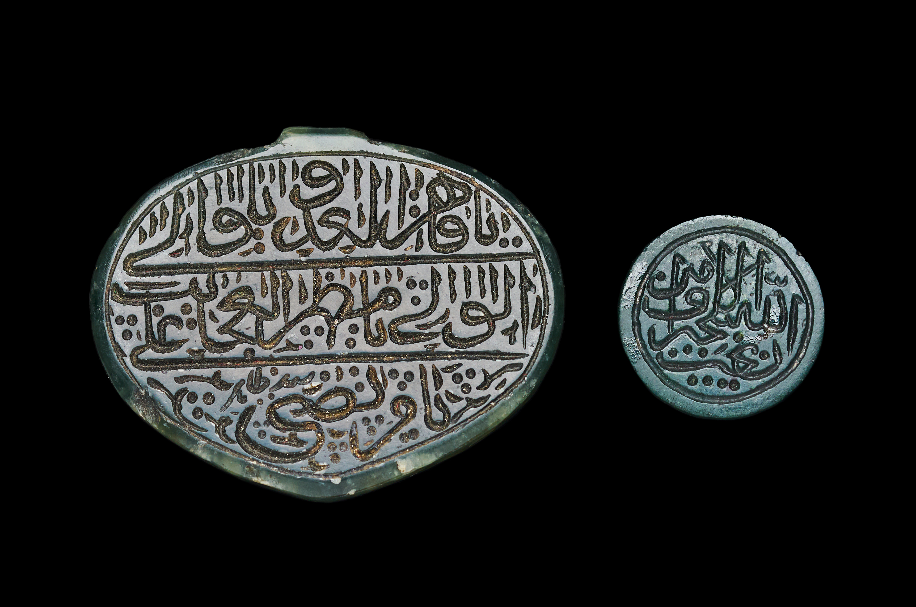 TWO PERSIAN OR NORTH INDIAN TALISMANIC NEPHRITE JADE AMULETS, 18TH - 19TH CENTURY
