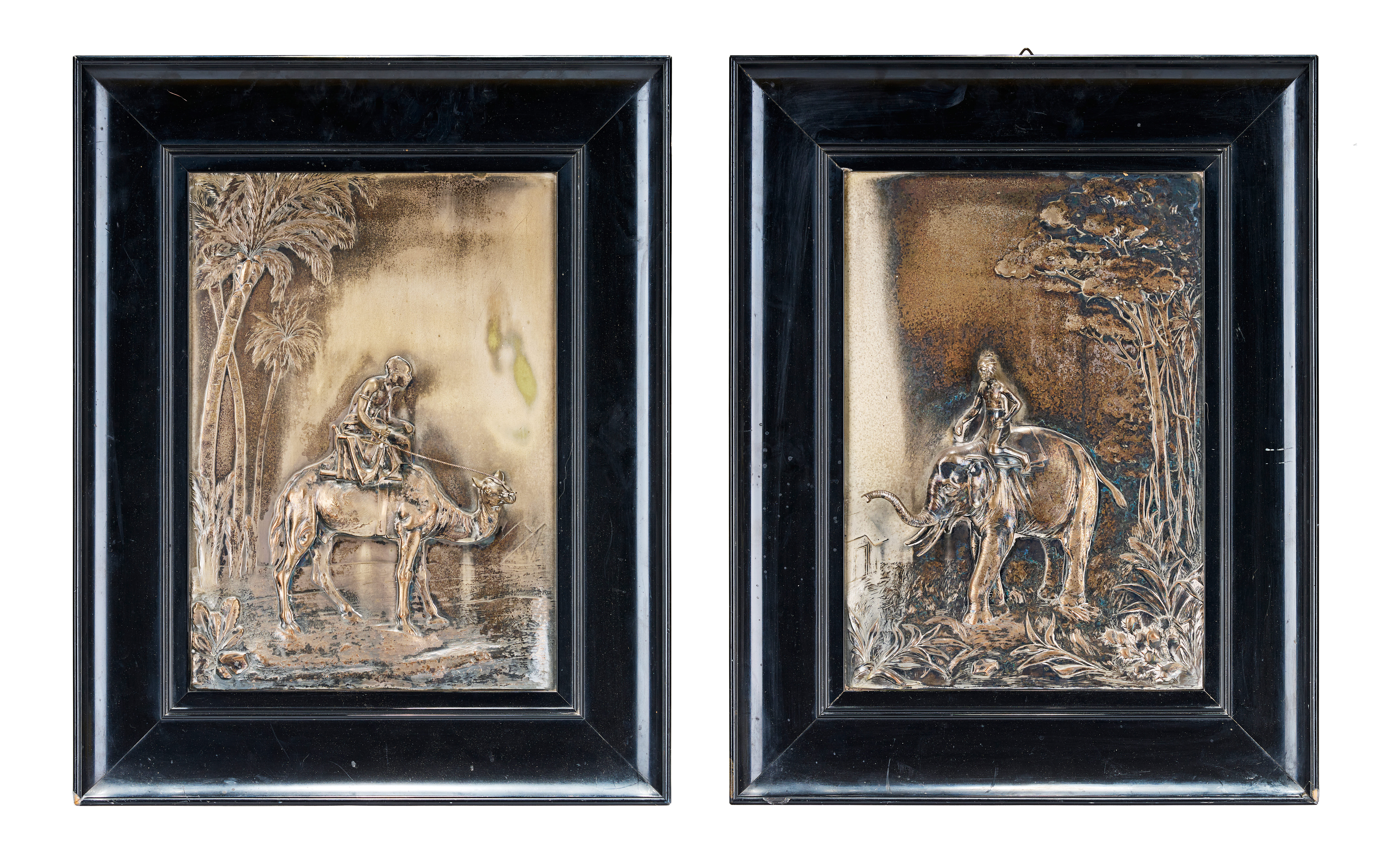 A PAIR OF SILVER-PLATED RELIEF PLAQUES DEPICTING AN ORIGINALIST ELEPHANT AND A CAMEL