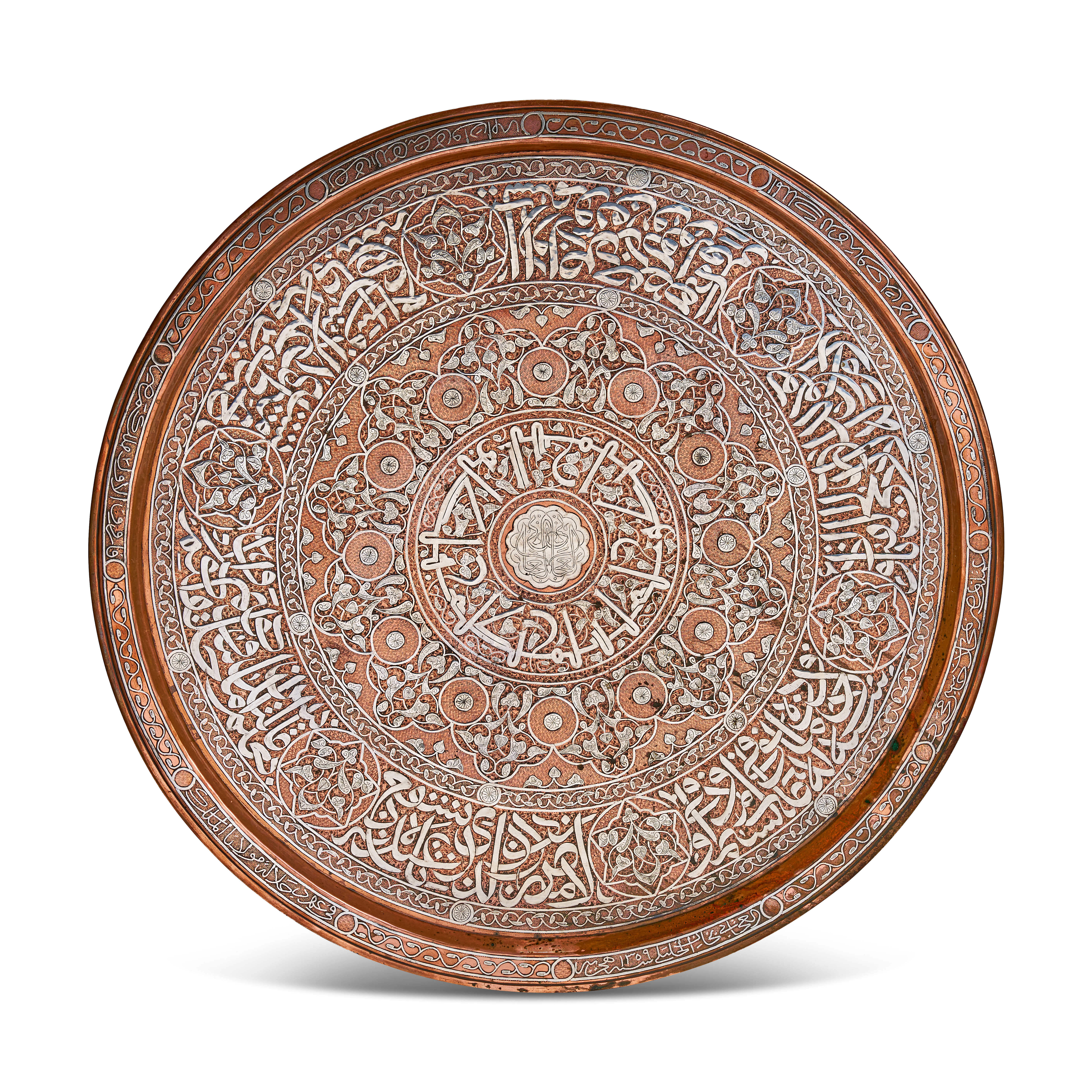 A LARGE DATED MAMLUK REVIVAL SILVER-INLAID COPPER CHARGER, CAIRO WARE, 1359 AH (1940-41 AD)