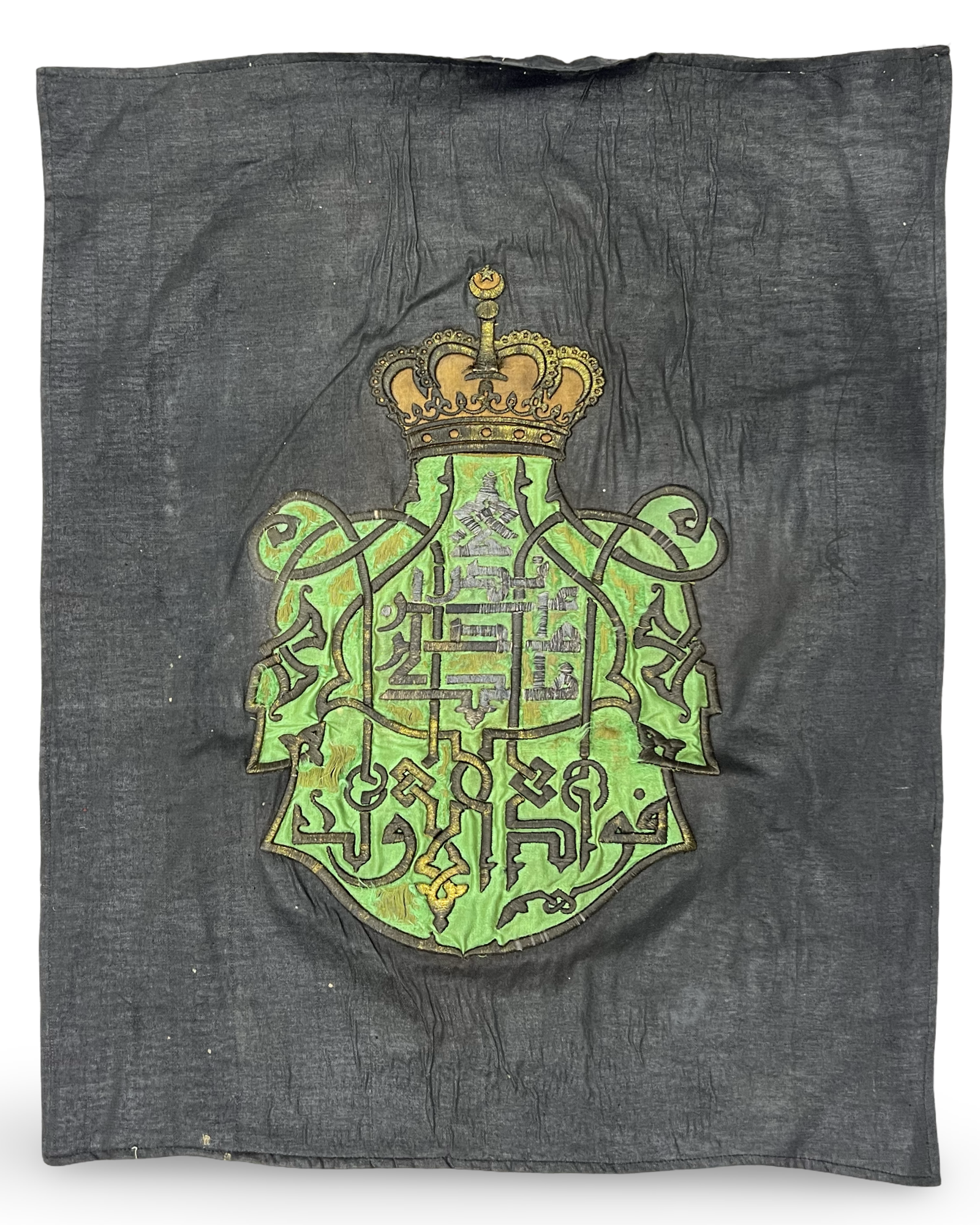 A ROYAL EGYPTIAN EMBROIDERED HERALDIC TEXTILE PANEL OF KING FUAD I