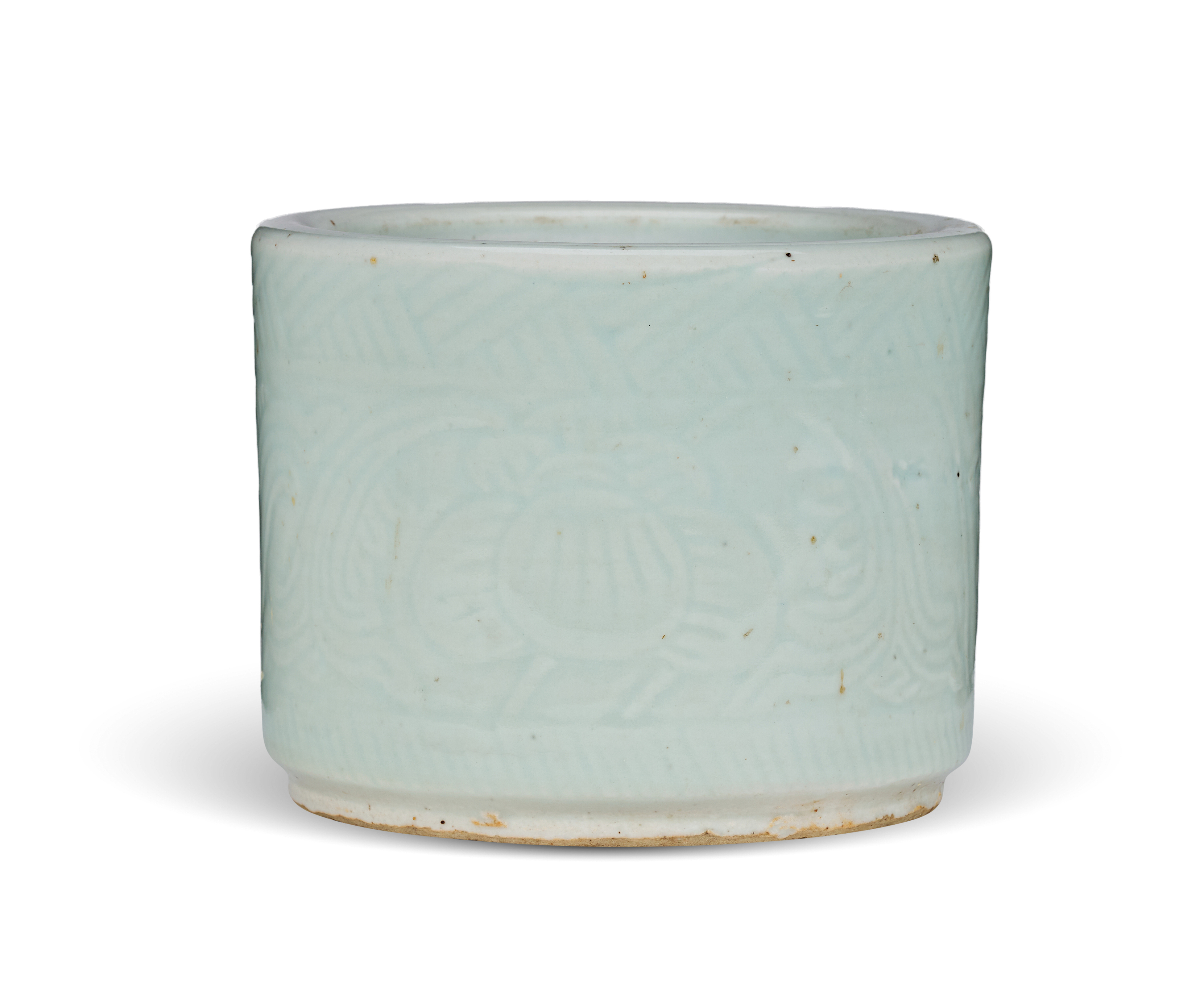A CHINESE PALE CELADON-GLAZED CYLINDRICAL BRUSH POT
