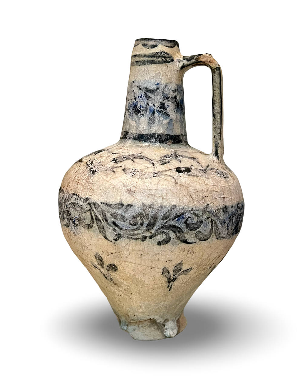 Lot 154: A RAQQA CERAMIC EWER WITH BLACK UNDERGLAZE DECORATION, SYRIA, 12TH CENTURY