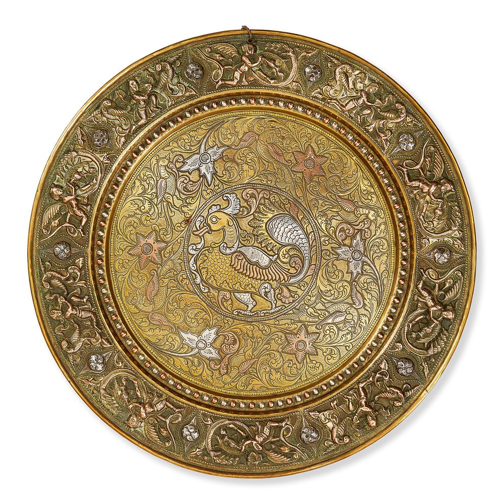 Lot 182: A SOUTH INDIAN TANJORE SILVER AND COPPER OVERLAID BRASS CHARGER, 19TH - 20TH CENTURY