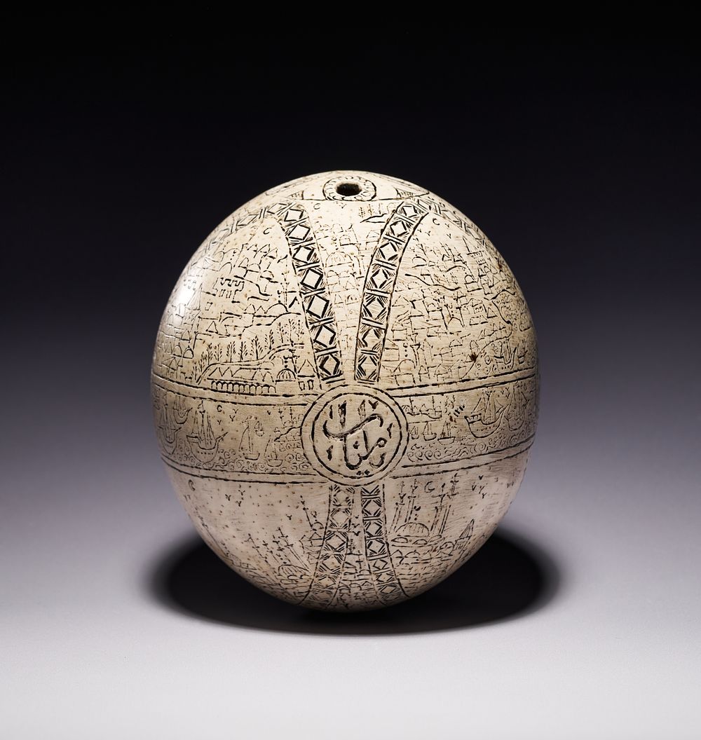 Lot 241: AN OTTOMAN ENGRAVED OSTRICH EGG HANGING ORNAMENT BY FEYZEI, TURKEY, DATED 1210 AH