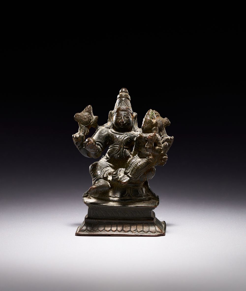 Lot 194: A SOUTH INDIAN BRONZE FIGURE OF LAKSHMI NARAYANA, 18TH CENTURY