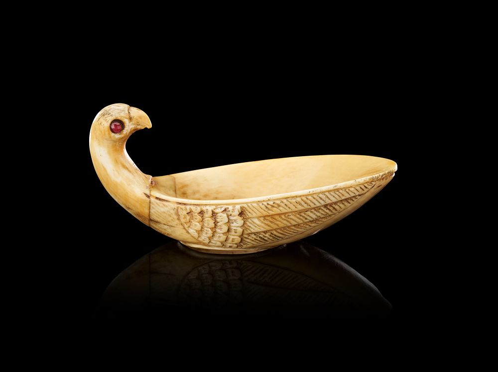 Lot 262: AN INDIAN CARVED BONE AND GEM-SET ARCHERS THUMB RING, MUGHAL, 18TH - 19TH CENTURY