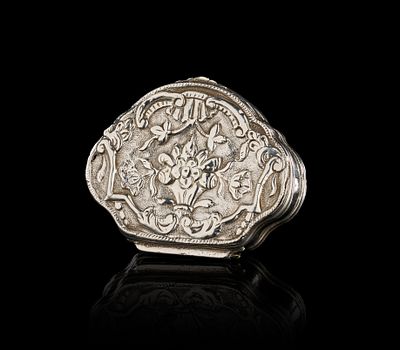 AN OTTOMAN SILVER SNUFF BOX WITH REPOUSSE FLORAL DECORATION, 19TH CENTURY. An antique silver 