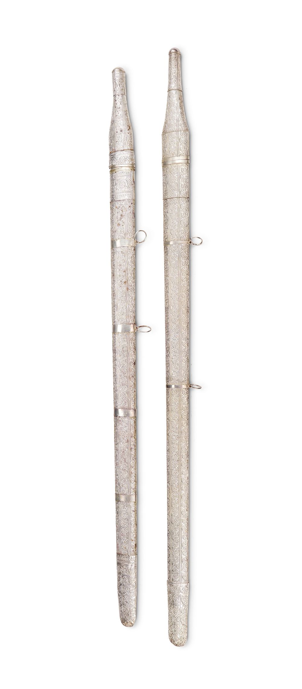 Lot 298: A PAIR OF OMANI WHITE METAL PRESENTATION SWORDS IN A FITTED WOODEN CASE, 20TH CENTURY