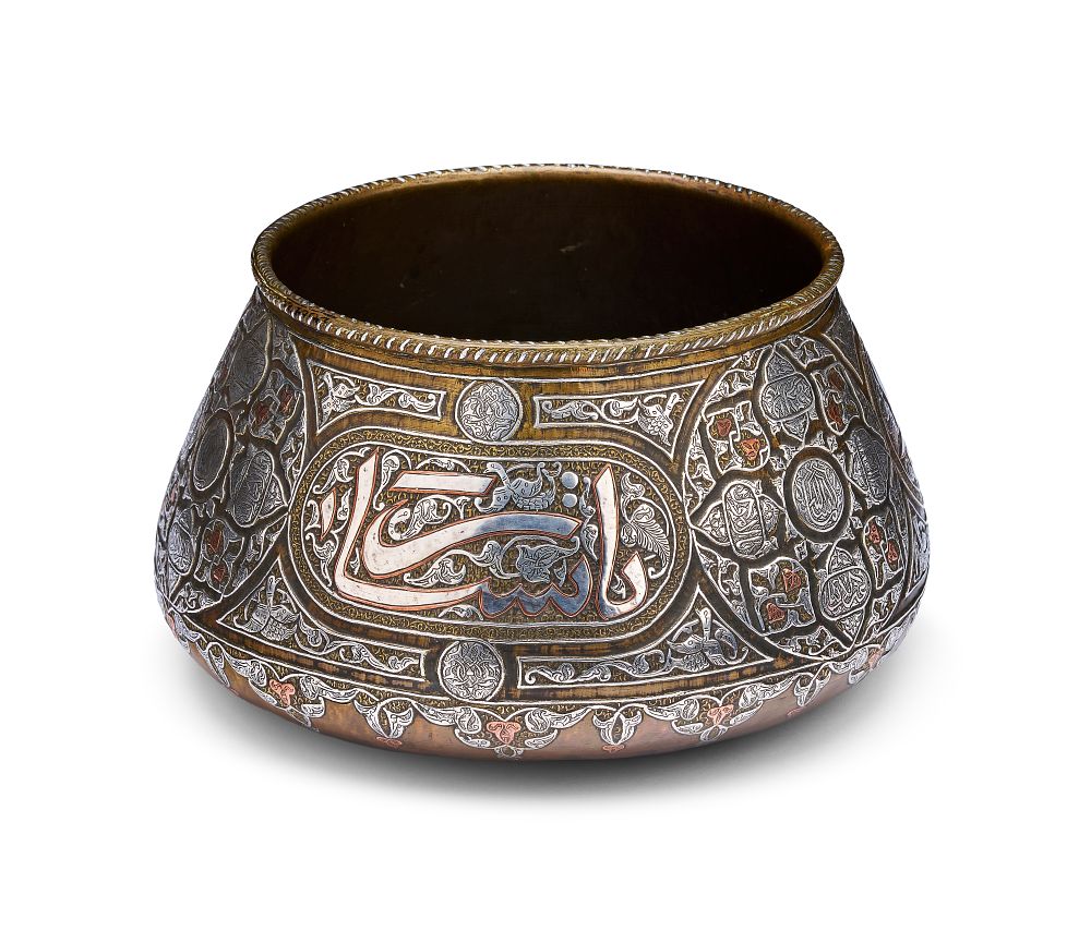 Lot 199: A MAMLUK REVIVAL SILVER AND COPPER INLAID BRASS BOWL, SYRIA, CIRCA 1900