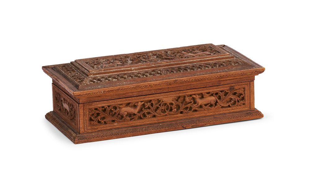 Lot 307: AN INDIAN CARVED SANDALWOOD BOX WITH ANIMALS AND FOLIATE SCROLLS, 19TH CENTURY