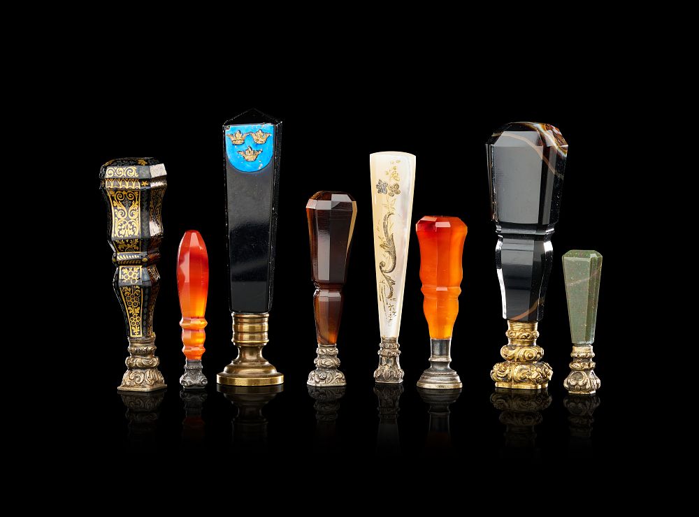 Lot 385: A COLLECTION OF EIGHT ANTIQUE HARDSTONE AND GILT-METAL DESK SEALS, 19TH CENTURY