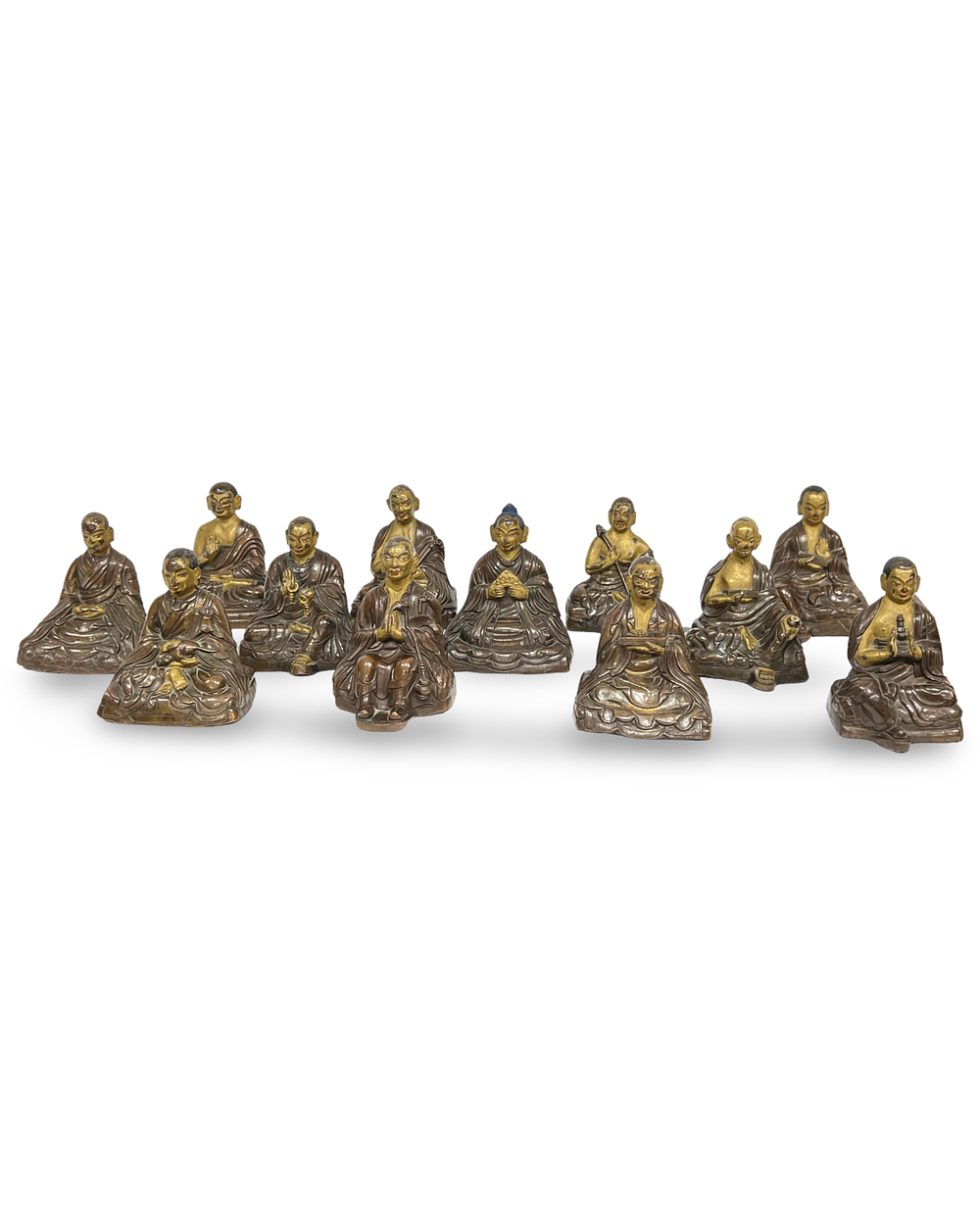 Lot 336: A SET OF TWELVE SINO-TIBETAN PARCEL-GILT BRONZE FIGURES OF ARHATS, 18TH CENTURY