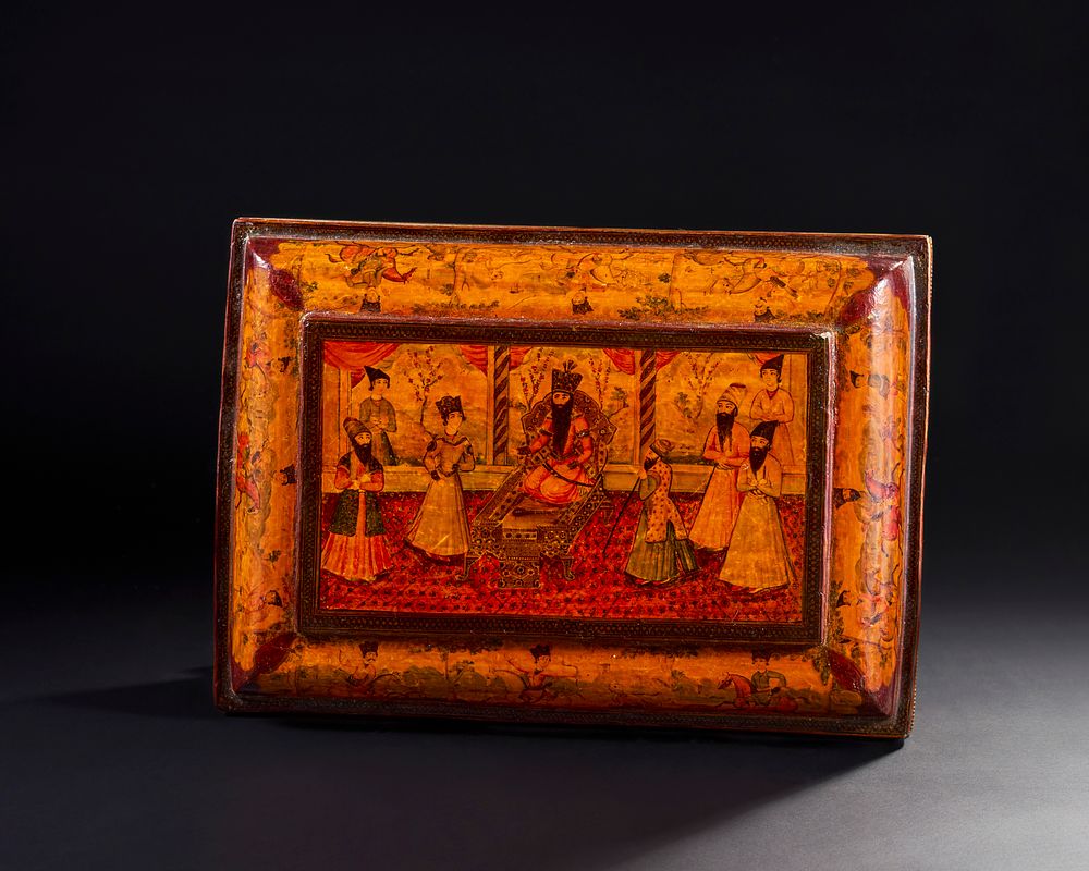 Lot 313: A LARGE 19TH CENTURY QAJAR LACQUERED PAPIER-MACHE CASKET DEPICTING FATH’ALI SHAH AND HUNTING SCENES