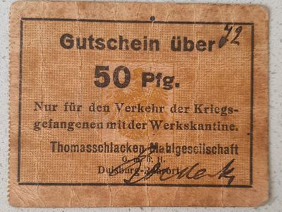 שובר (Gutschein) של 50 פפניג (Pfg.). 
הוא נועד לשימוש בלעדי של שבויי מלחמה בקנטינת המפעל.