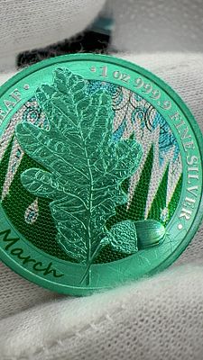 מטבע כסף טהור 1 אונקיה 'עץ מנטה אלון' ירוק - מרץ. מטבע מנטה כסף טהור 999.9 🪙 1 אונקיה, **עיצוב 