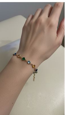 צמיד נדיר מאבני חן צבעוניות, עבודה איטלקית מזהב גולדפילד צהוב 14 ק. ובשיבוץ עיגולי צבע.