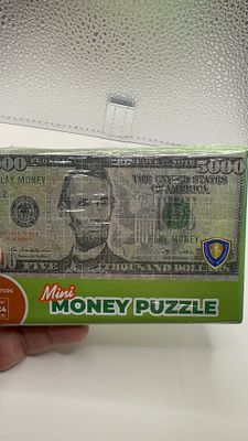 פאזל כסף מיני. 🧩 **פאזל כסף מיני** - אתגר מרתק במיוחד! 💵 הרכיבו את שטר ה-5000$ המפורסם. 🎁 