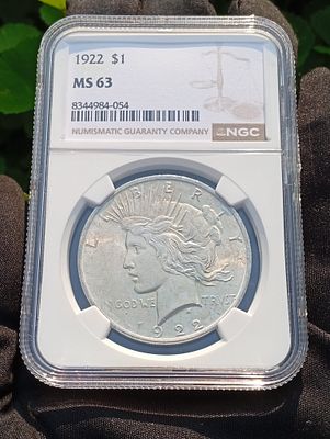 דולר שלום 1922 (Peace Dollar) מדורג NGC MS63 ועשוי כסף 90%. הוטבע בפילדלפיה. מטבע זה אינו 