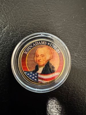 מטבע מיוחד מאוד חוקי ונדיר מצופה זהב 24K של Quarter. מסידרת נשאי ארה״ב. הנשיא גו׳ן אדאמס