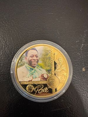 Pel&eacute; – Gold-Tone Fantasy Coin with Color Print. A gold-tone fantasy coin dedicated to Brazilian 