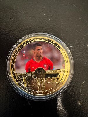 Cristiano Ronaldo – Gold-Tone CR7 Souvenir Coin. A collectible souvenir coin dedicated to 