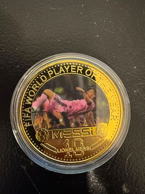 Lionel Messi – Gold-Tone “FIFA World Player of the Year” Souvenir Coin. A collectible souvenir 
