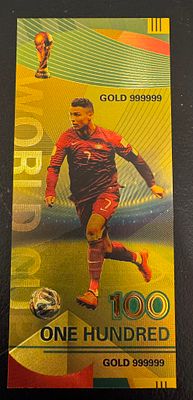 Cristiano Ronaldo – Gold-Tone “World Cup” 100 Fantasy Banknote. A gold-tone collectible fantasy 