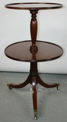 English Regency 2 tier dumb waiter butlers table in mahogany. On tri-ped base. 2 circular trays 