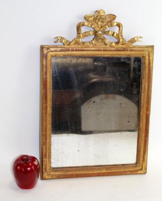 French Louis XVI style gold leaf mirror with ribbon. Mid 19th century. 19 1/2"h x 13"w