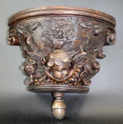 French relief carved cherub corbel in oak. 18th century. 15"h x 16"w x 8 1/2"d