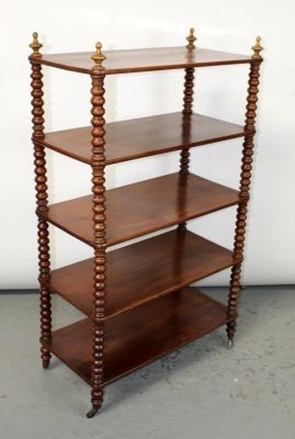 French Louis Philippe etagere in mahogany with bobbin carved supports. On casters. Mid 19th 