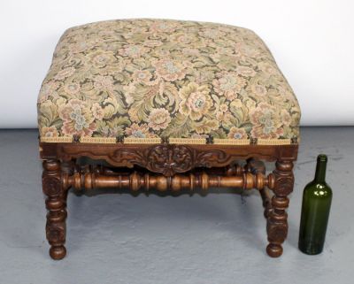 French carved walnut foot stool with mythological mask. Early 20th century. 19 1/2"h x 29"w x 29"d