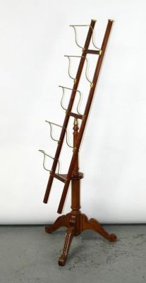 Birch and brass rotating hotel lobby newstand rack. Late 20th century. 68"h x 23"w at base