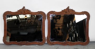 Pair of French Louis XV framed mirrors in carved walnut frames. Early 20th century. 24 1/2"h x 26"w