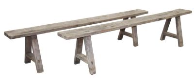 Pair of French primitive farmhouse backless benches in weathered oak. 19th century. 18"h x 79"l 
