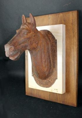 Cast iron horse head stable sign on wooden plaque. 20th century. 20"h x 14 1/2"w overall