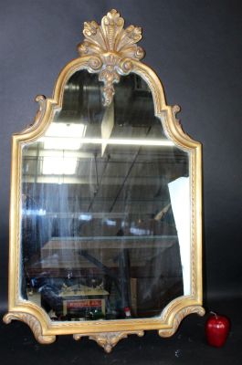 Vintage French gold leaf shield form mirror. Mid 20th century. 42"h x 23 1/2"w