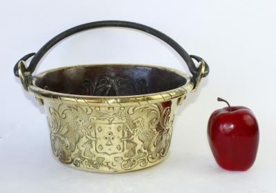 French embossed brass pot with lion crests and fleur de lys. Iron handle. 19th century. 5 1/4"h 