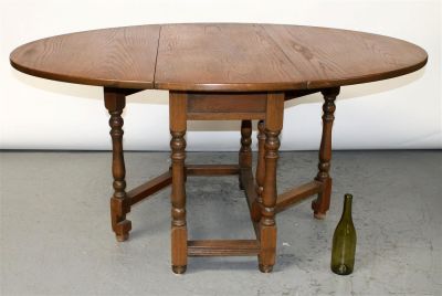 English gate leg drop side table in oak. Early 20th century. 29 1/2"h x 60"l x 45"w, Closed 19 