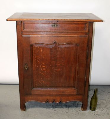 French Provincial single door bibus cabinet in oak. 19th century. 43 1/2"h x 38 1/2"w x 21"d