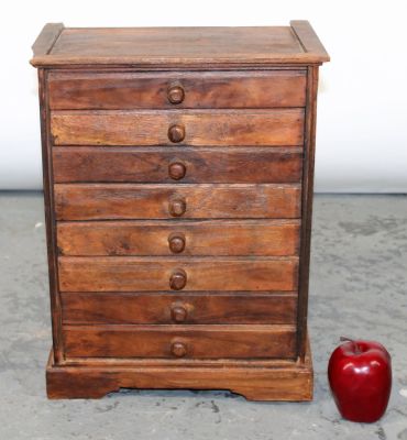 Diminutive 8 drawer collector's cabinet. 16 1/2"h x 12 1/2"w x 7"d
