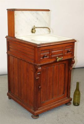 Antique rail road car lavabo sink in pine cabinet with marble back and porcelain sink. Late 