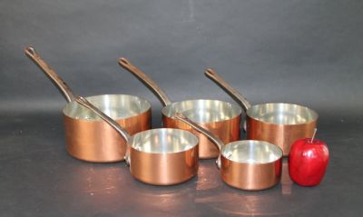 Set of 5 French copper pots. Each marked Fabrication Francaise. Largest 4"h x 8"dia x 14"l with 