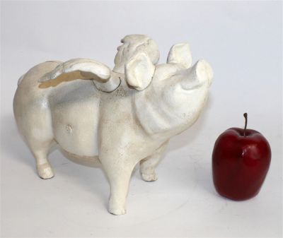 Cast iron flying pig bank. Late 20th century. 8 1/2"h x 13"l x 7"w